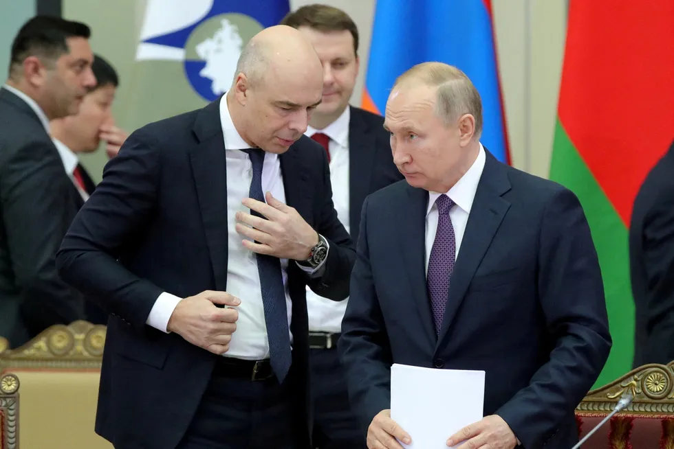 Tax concerns: Russian Finance Minister Anton Siluanov (left) speaks to President Vladimir Putin (right).