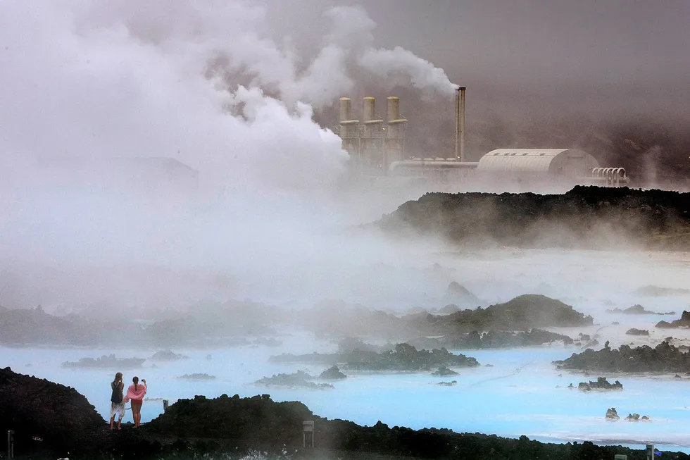Looking ahead: Visitors take pictures of the Svartsengi geothermal power plant near the Blue Lagoon hot springs in Iceland