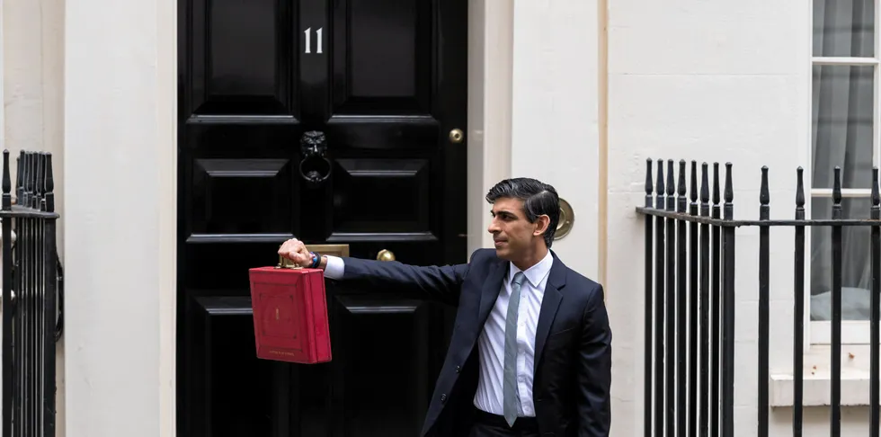 Chancellor of the Exchequer Rishi Sunak holds the Budget box outside 11 Downing Street in central London.