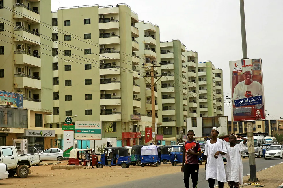 Capital scene: children walk along a street in Khartoum, Sudan