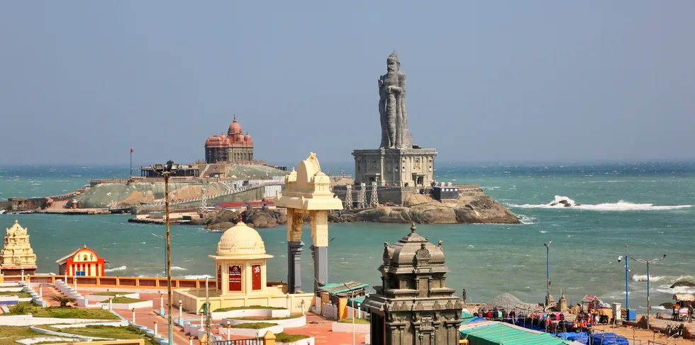 The Vivekananda Rock Memorial temple and statue of the ancient Tamil poet Thiruvalluvar seen in the ocean in Kanyakumari, Tamil Nadu.