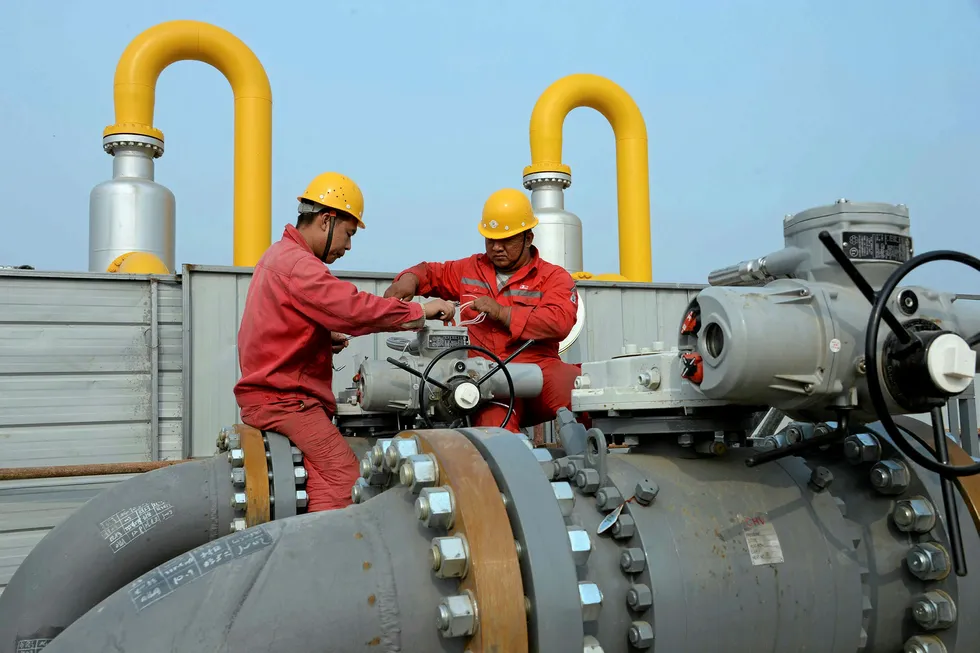 Demand destruction: Sinopec employees work on pipelines connecting a Sinopec natural gas facility and Binhai transmission station in Tianjin