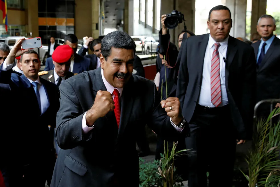 Keeping hold of power: Venezuela's President Nicolas Maduro celebrates after receiving confirmation he won another term in office