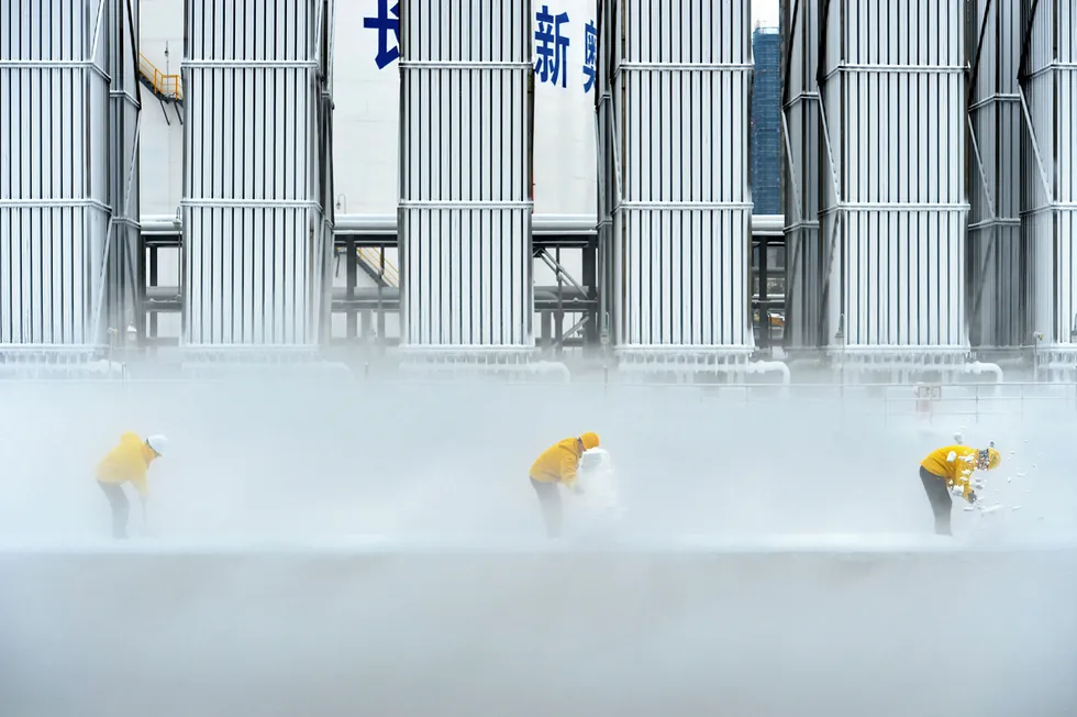 Season's greetings: workers remove snow this week at an LNG facility in Changsha, Hunan province, China