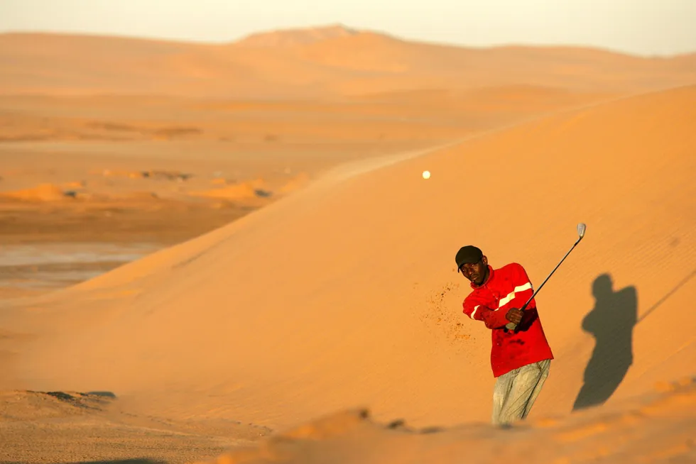 Taking a shot: from a roadside desert golf course close to the oilfields of Namibia where Chevron has scored a hole in one.