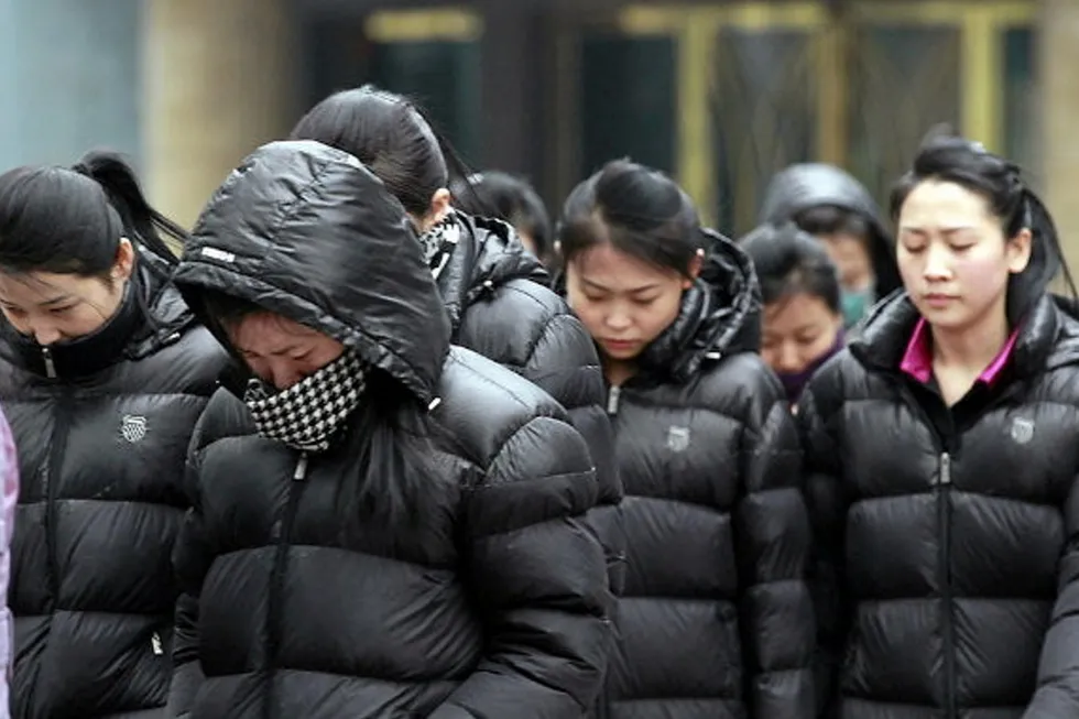 A group of North Korean women in the streets of Dandong, China in March 2023 being overseen by a government minder. The use of such workers in China is in violation of United Nations sanctions.
