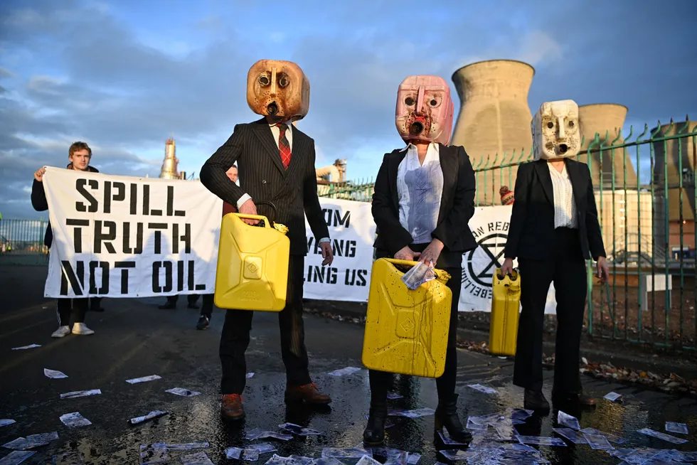 Talking heads: Climate activists demonstrate outside the Grangemouth refinery and petrochemical plant in Scotland. Owner INEOS has promised a decarbonisation project for the facility.