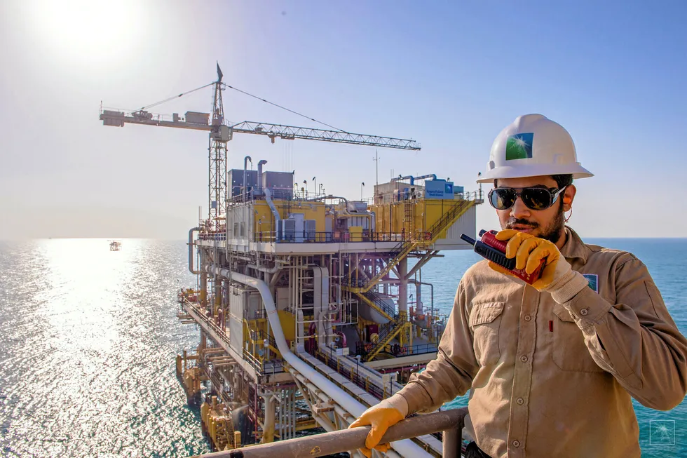 Pressure: a worker at the Tanajib oil complex off Saudi Arabia