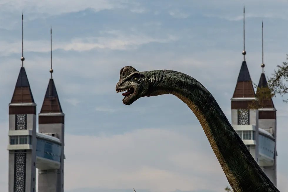 Imposing: a dinosaur statue near a drawbridge in the Malaysian state of Terengganu