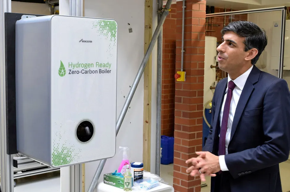 UK Prime Minister Rishi Sunak being shown a hydrogen-ready boiler manufactured by Worcester Bosch.