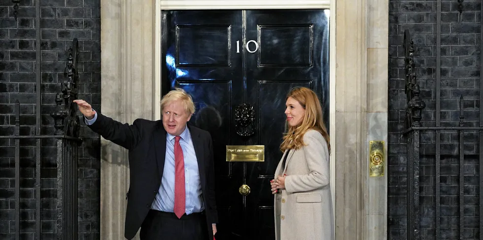 Prime Minister Boris Johnson and his partner Carrie Symonds enter Downing Street as the Conservatives celebrate a sweeping election victory.