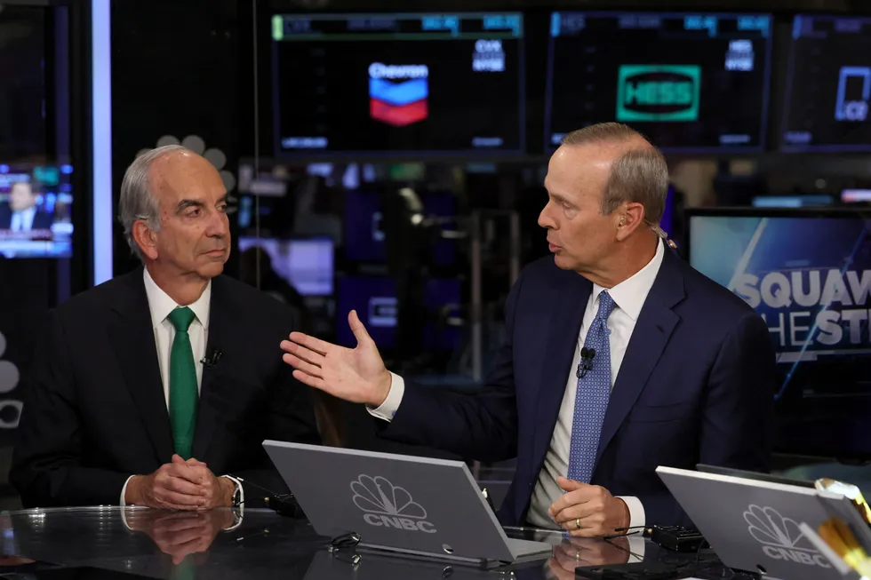 Chevron chief executive Mike Wirth and Hess chief executive John Hess appear on CNBC to speak about Chevron's deal to buy Hess for $53 billion on the floor of the New York Stock Exchange (NYSE) in New York City, US, on 23 October, 2023.