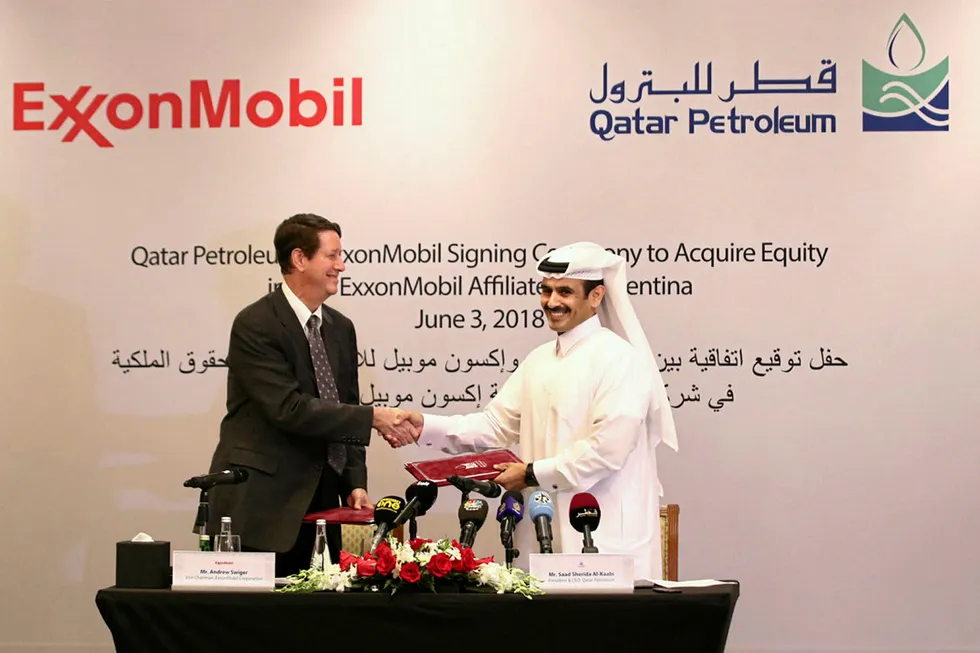 Deal signing: Qatar Petroleum's chief executive Saad Sherida Al-Kaabi (right) and ExxonMobil's principal financial officer Andrew Swiger at signing of Argentina deal in Doha