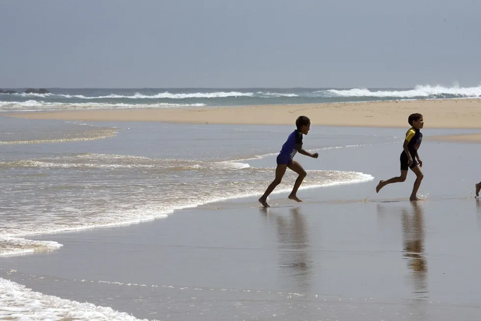 Potential offshore riches: youngsters play on Sardinia Beach near Port Elizabeth, South Africa, which lies close to New Age's Algoa-Gamtoos licence