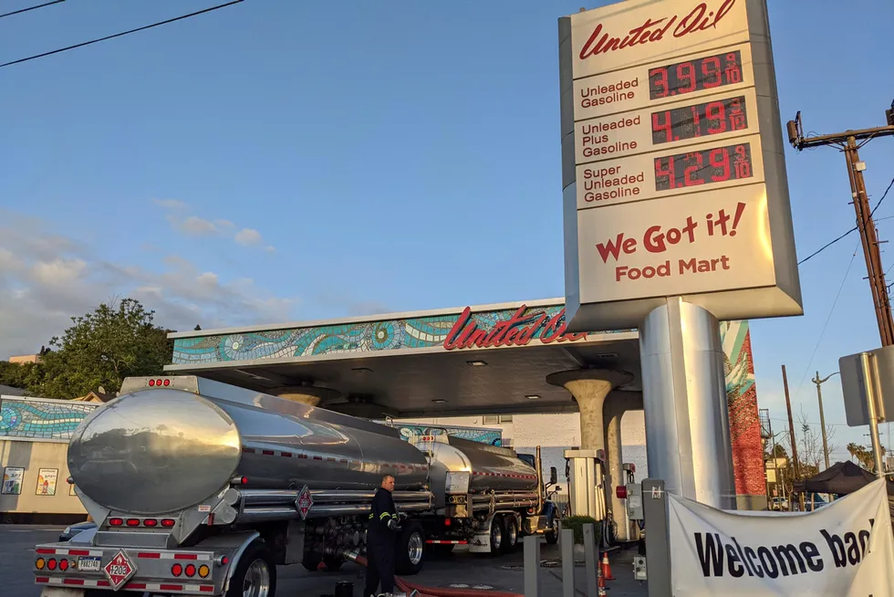 Oil price high: a fuel truck driver checks the gasoline tank level at a United Oil gas station in Sunset Boulevard, in Los Angeles, US