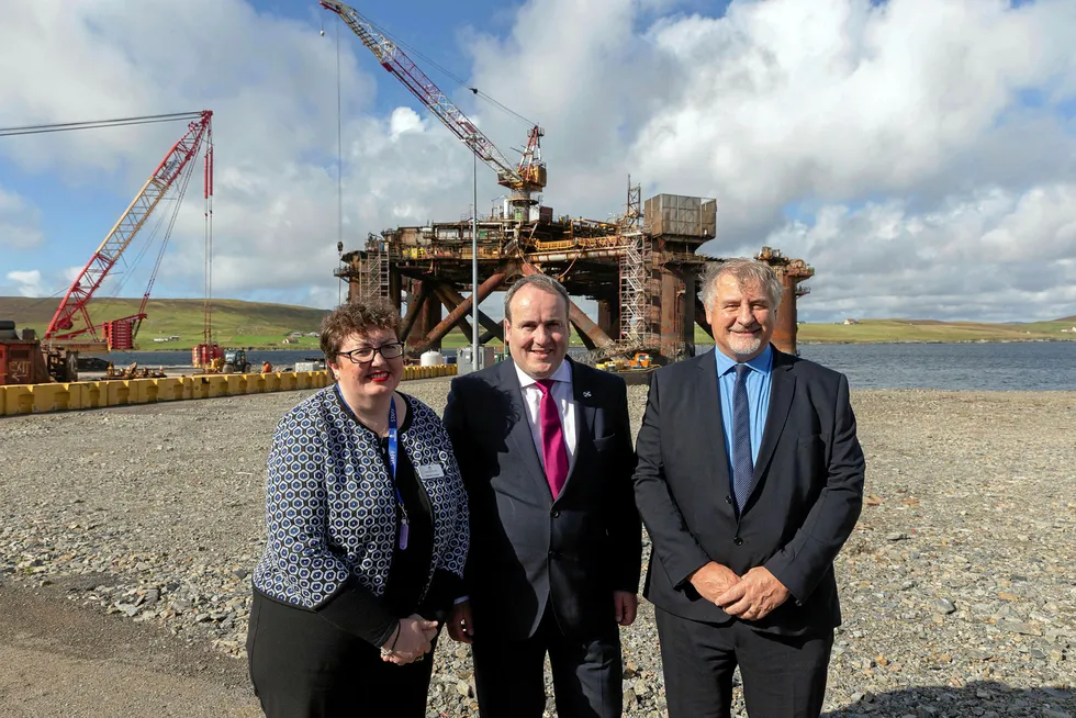 Backing: at Dales Voe against a backdrop of Buchan Alpha, from left, Shetland area manager at Highlands & Islands Enterprise Rachel Hunter, Scottish Energy Minister Paul Wheelhouse and OGA operations director Gunther Newcombe