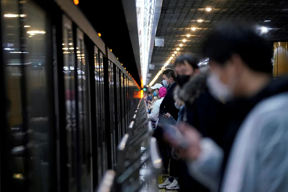 Protective measures: People wearing face masks are seen on 10 February at a subway station in Shanghai, China, after the extended Lunar New Year holiday caused by the novel coronavirus outbreak