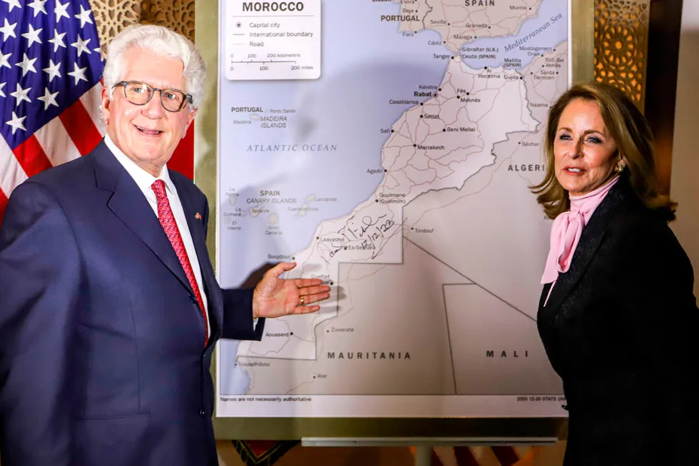Disputed: David Fischer, US Ambassador to Morocco, and his wife stand before a US State Department-authorised map of Morocco recognising the disputed territory of Western Sahara as part of Morocco