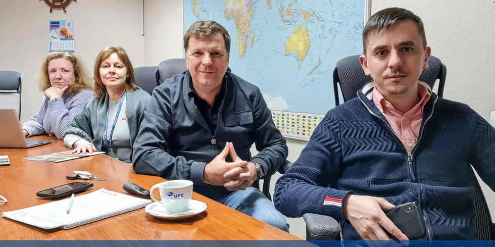 Universal Fish Company Chairman Oleg Lushchyk (centre) encouraged the company's 1,500 employees to stay strong.