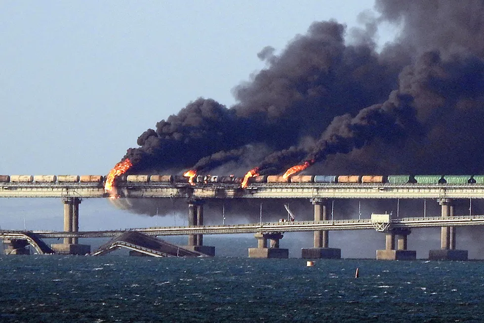 Annihilation: Smoke billows from a fire on the Kerch bridge that links the Crimea Peninsula with Russia’s Krasnodar region after the explosion of a truck near the Crimea’s port of Kerch in October 2022.