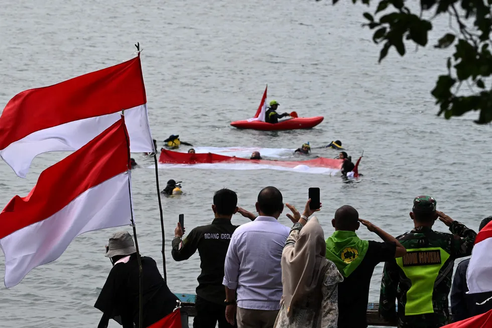 Scuba diving: university students with the Indonesian national flag mark the country's 78th Independence Day on 16 August 2023.