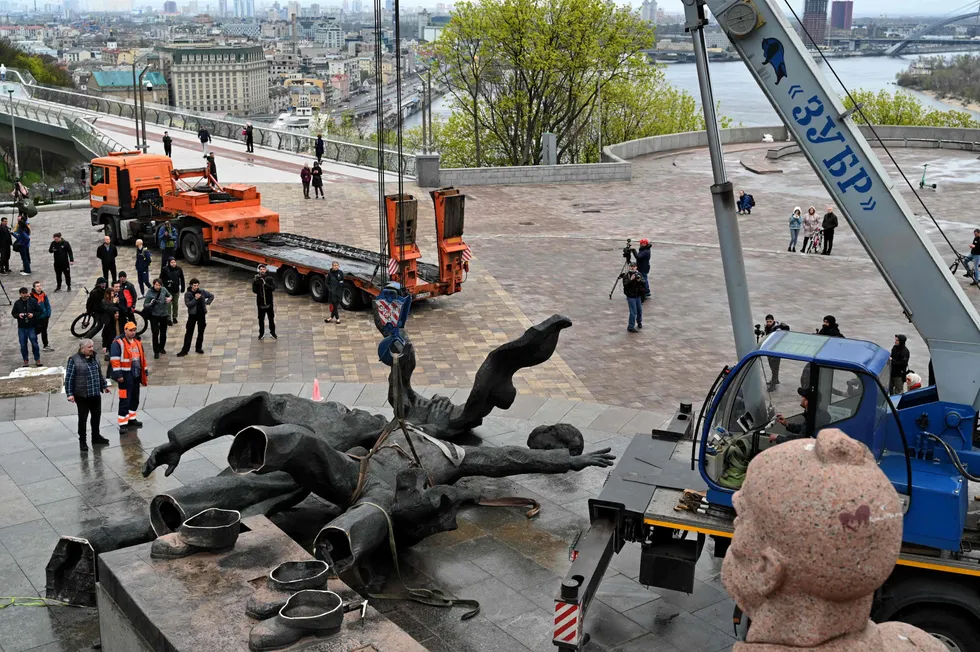 Historic ties broken: workers dismantle the Soviet monument to Ukraine-Russia friendship in the Ukrainian capital Kyiv on 26 April