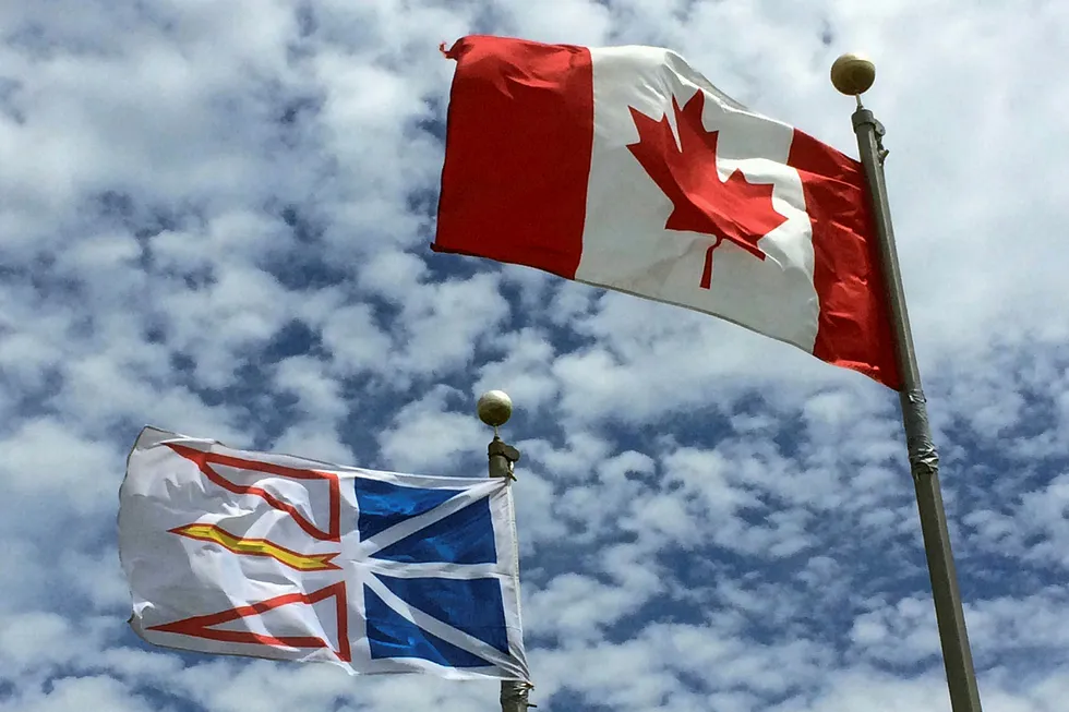 Exploration: Newfoundland & Labrador's provincial flag flies next to the Canadian flag