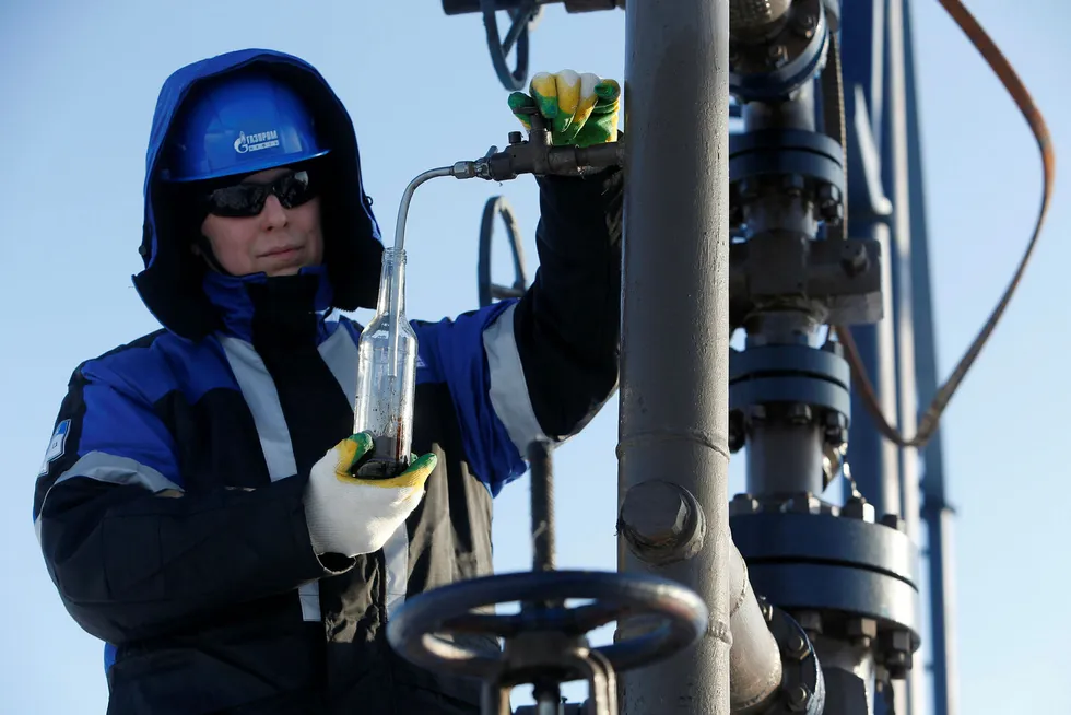 Answer positive: a worker takes an oil sample at the Priobskoye oilfield in the Khanty-Mansiysk region in Russia