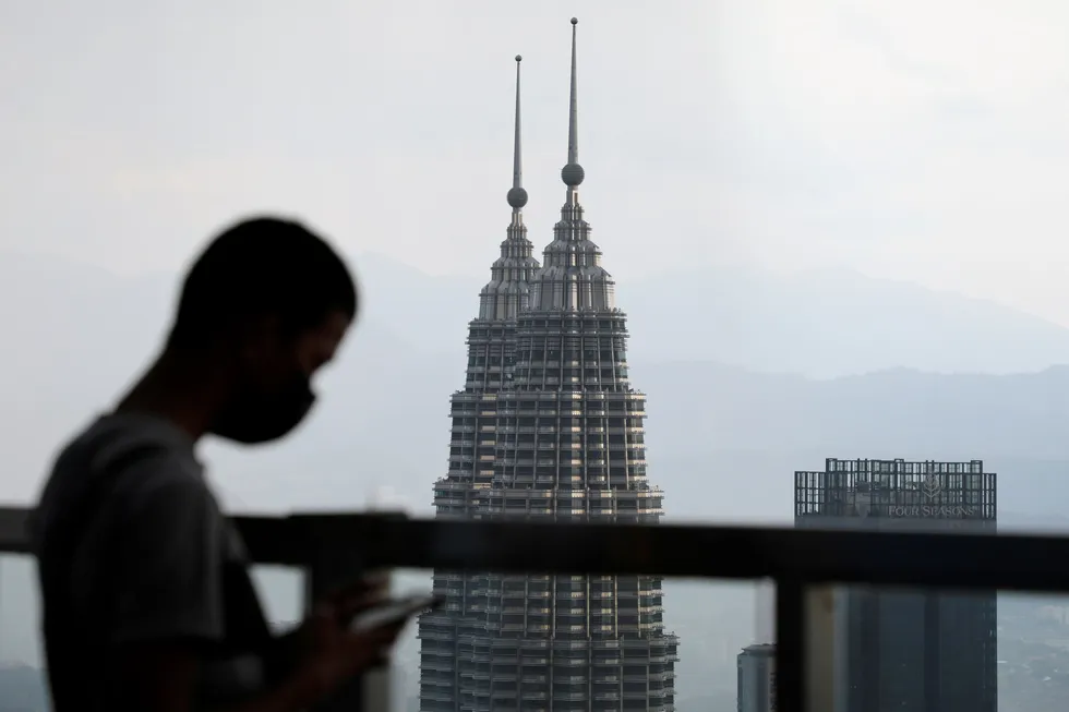 High hopes: Petronas Twin Towers are seen in the background in Kuala Lumpur, Malaysia