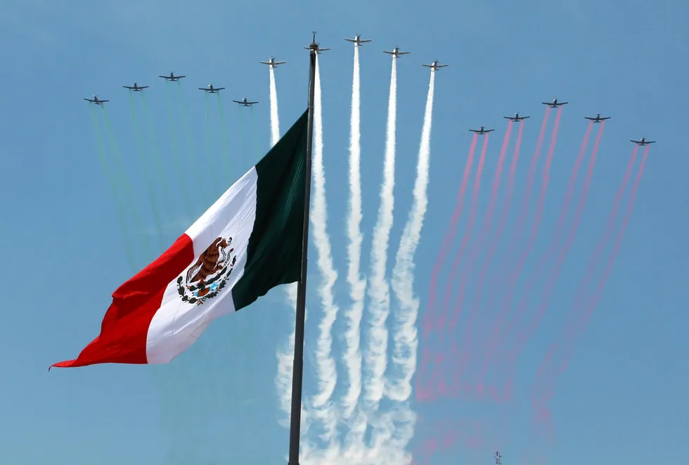 Approved plan: aircrafts fly in formation over a Mexican flag during a military parade