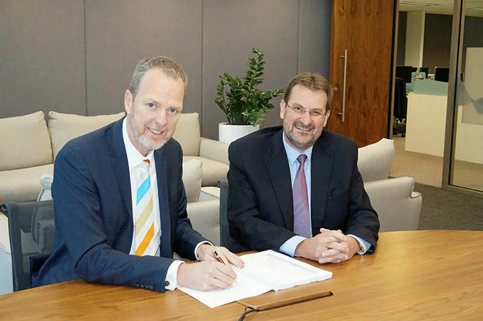 Back on board: Jemena managing director, Paul Adams with McConnell Dowell chief executive Scott Cummins at the signing ceremony
