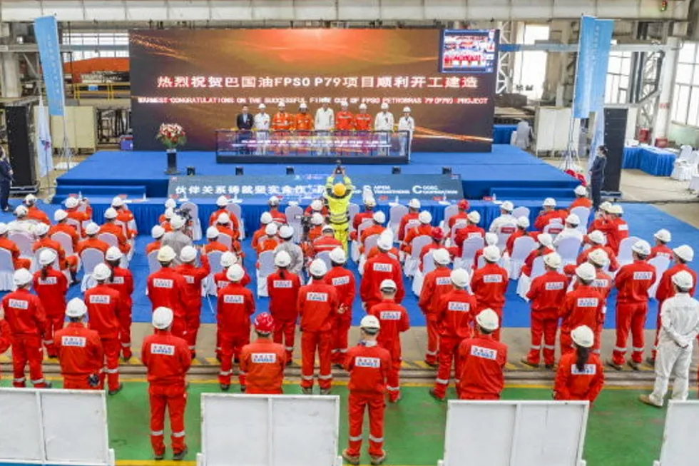 Ceremony: COOEC workers celebrate cutting the first steel for the Brazil-bound P-79 FPSO’s topsides