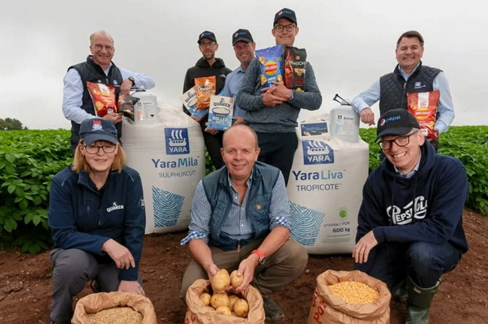 Executives from Yara and PepsiCo, as well as a farmer, in a potato field in the UK, one of the countries where low-carbon fertilisers will be used.