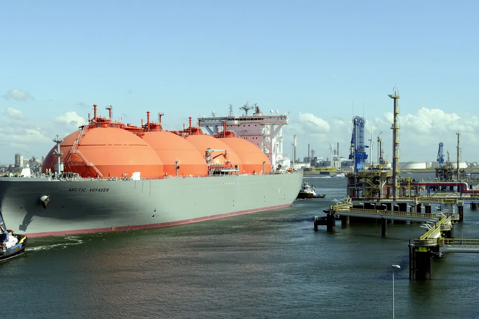 Transportation: a liquefied natural gas carrier being towed to the Gate terminal in the port of Rotterdam, the Netherlands