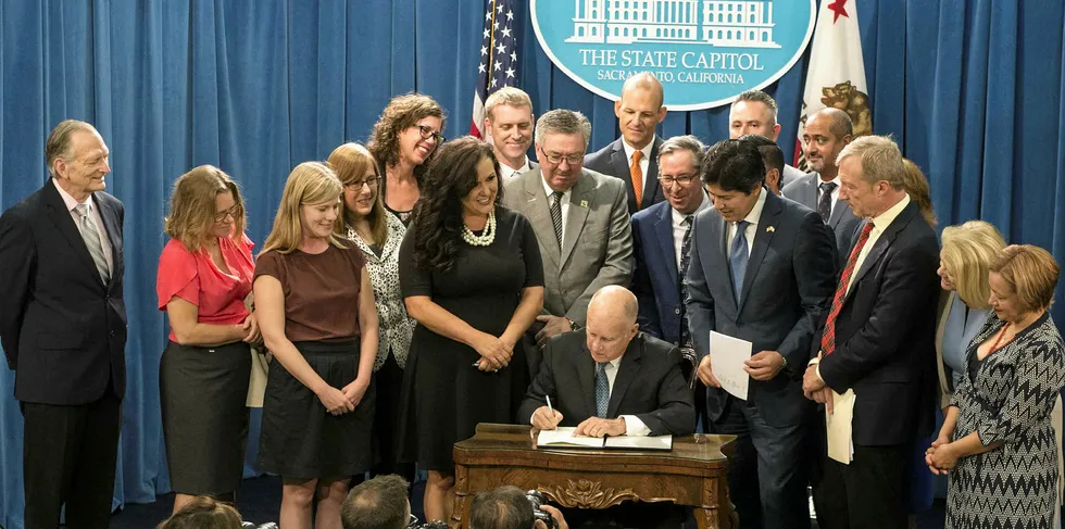 Former California governor Jerry Brown signs SB100, the 2018 law that commits the state to 100% fossil-fuel-freen electricity by 2045. This type of 'command and control' legislation could be enacted by any legislature.