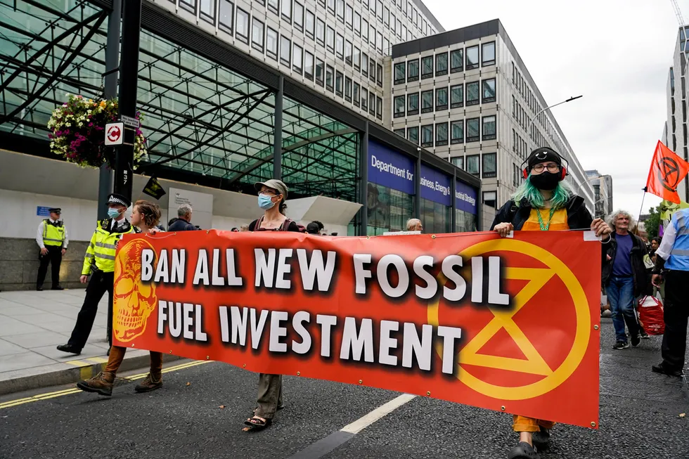 Mounting pressure: demonstrators march in front of the Department for Business, Energy and Industrial Strategy in the UK capital London during a August 2021 protest organised by the climate activists group Extinction Rebellion