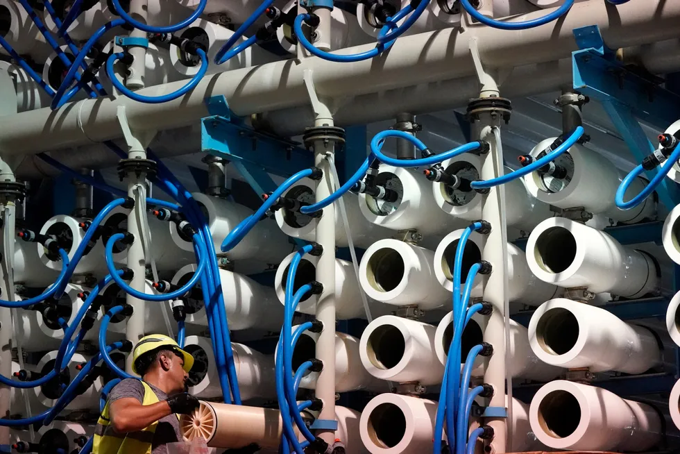 Separation game: a man performs maintenance work on a reverse osmosis module at a desalination plant in Carlsbad, California, US, the largest facility of its kind in the western hemisphere.