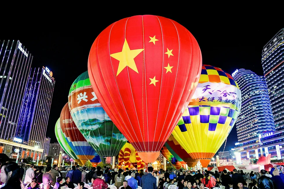 Guizhou shale drive: people watching hot air balloons displayed on a square in Xingyi in China's southwestern Guizhou province