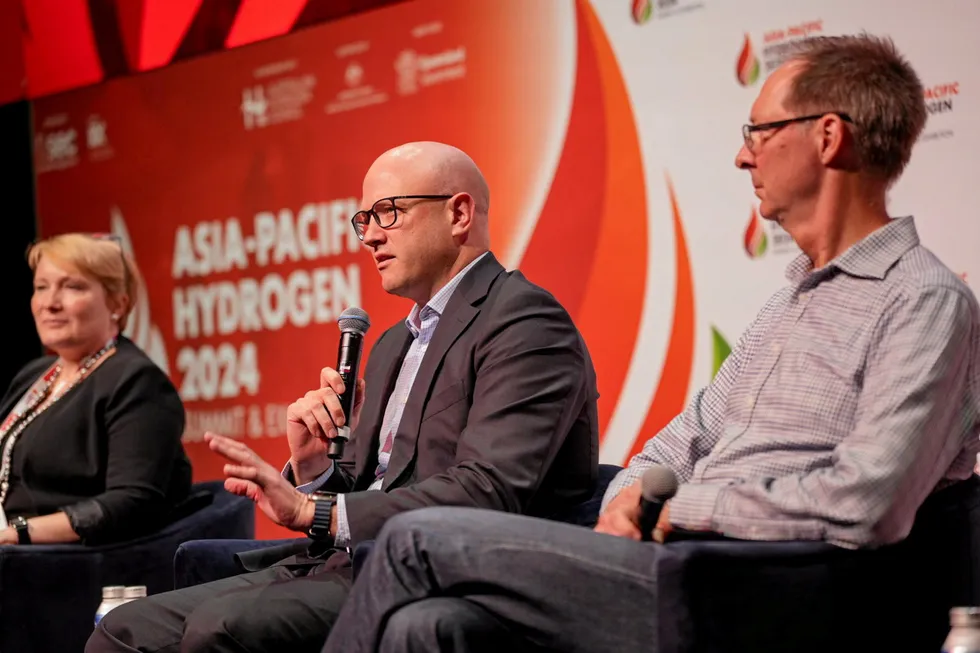 . Rupert Maloney, centre, speaking at the Asia-Pacific Hydrogen Summit alongside Australian Hydrogen Council CEO Fiona Simon and Safoir founder David Lloyd.