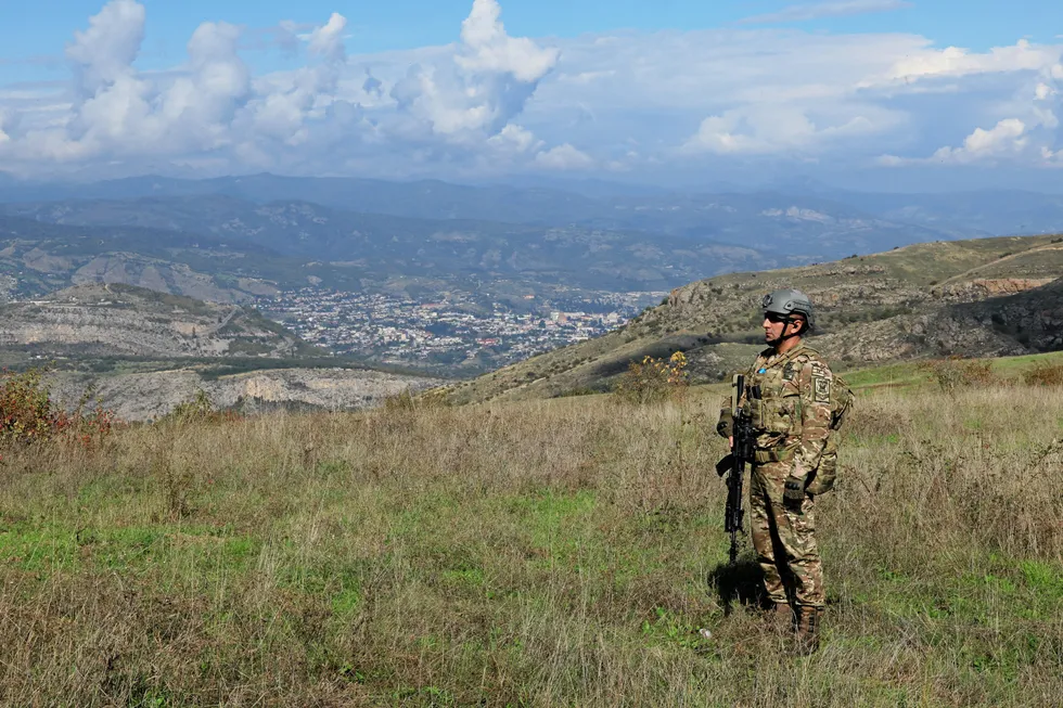 An Azeri soldier stands above the now-deserted ethnically Armenian city of Stepanakert in the Nagorno-Karabakh of Azerbaijan, which had been the capital of the breakaway state of Artsakh.