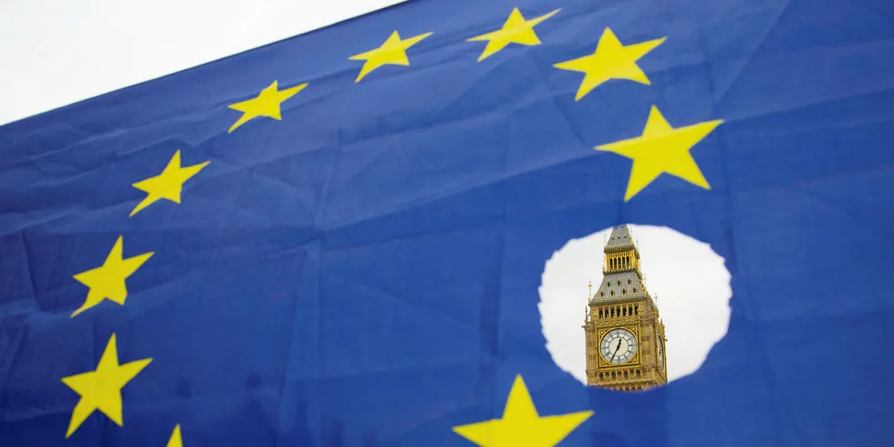 Westminster’s Elizabeth Tower (aka Big Ben) seen through an EU flag where a star has been cut out to signify the UK’s departure from the union.