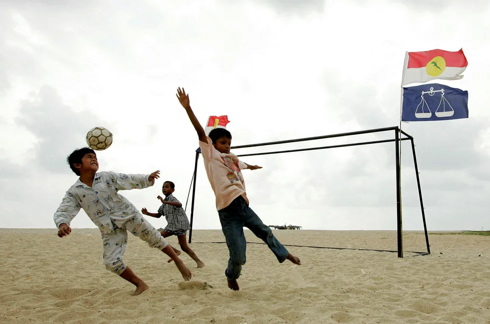 Net gains: children play soccer on a beach in the state of Terengganu in Peninsular Malaysia