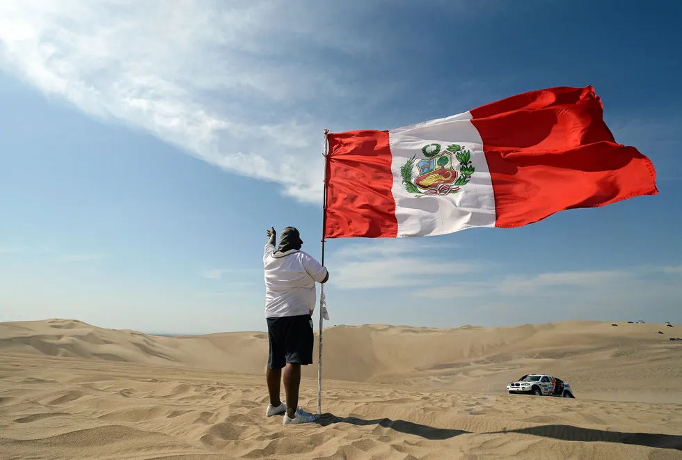 Proud Peruvian: holds the national flag