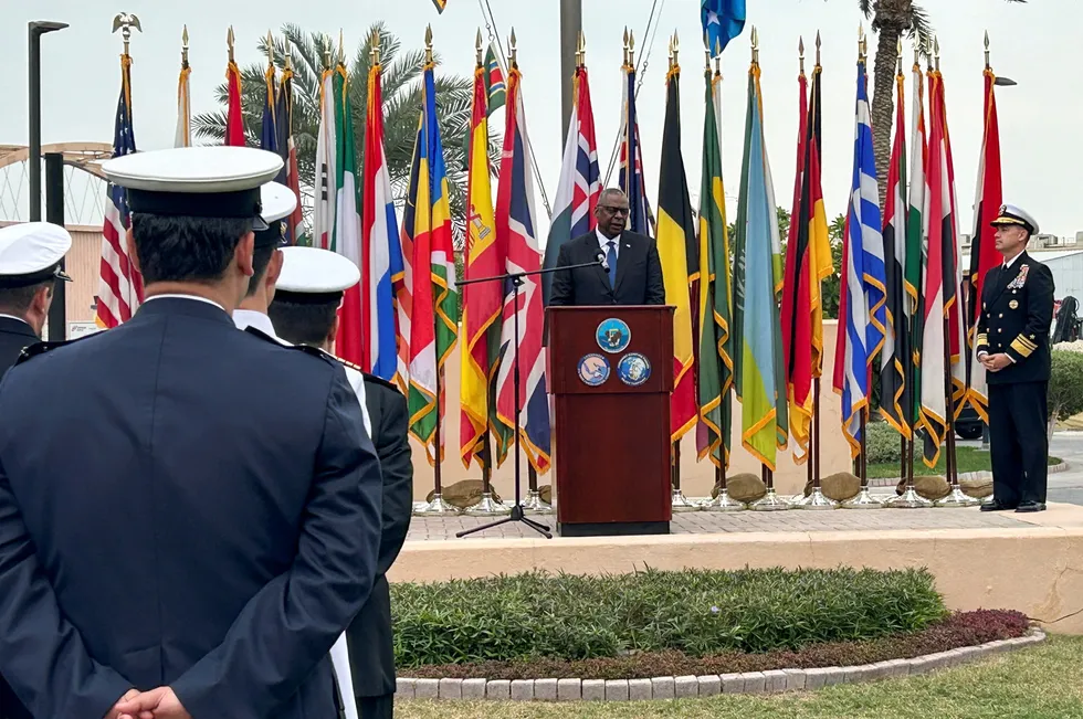 US Defense Secretary Lloyd Austin addresses US forces in Bahrain on Tuesday. The US government has reportedly announced the creation of a multinational operation to safeguard Red Sea commerce.