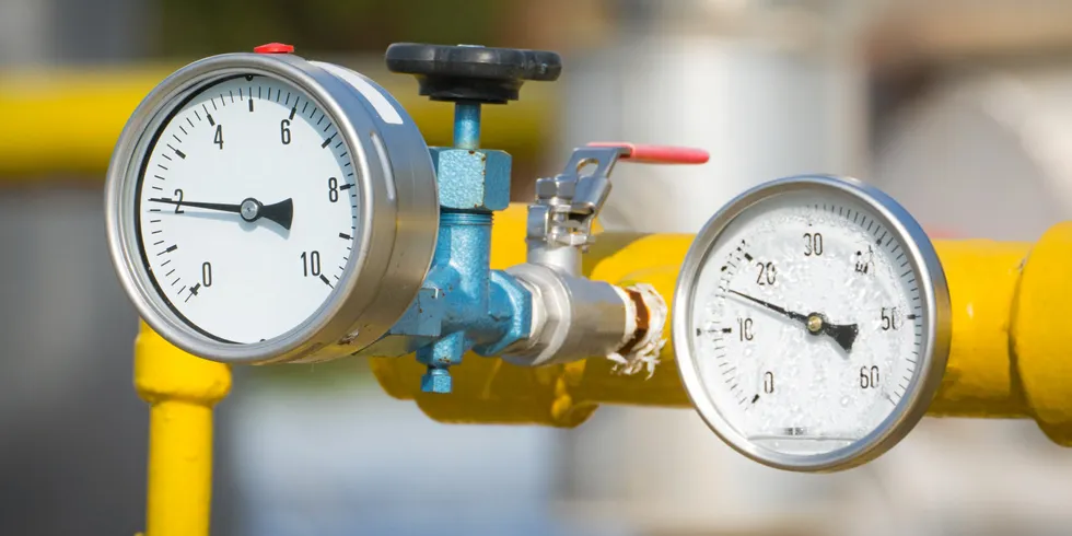 A gas line with valve and pressure meters.