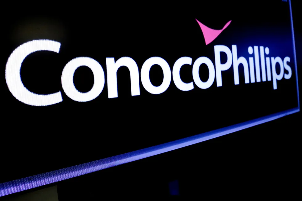 Displayed: the logo for ConocoPhillips on a screen on the floor at the New York Stock Exchange