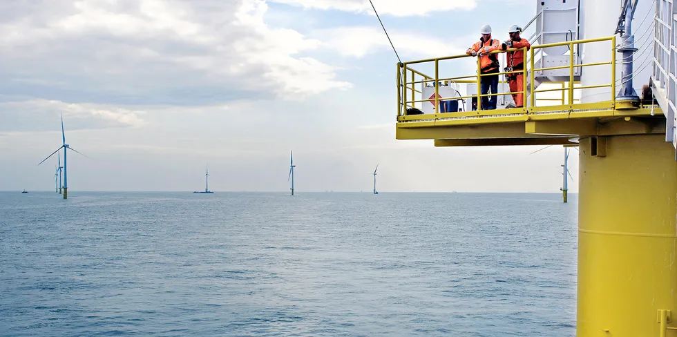Two workers at an offshore wind farm in the North Sea