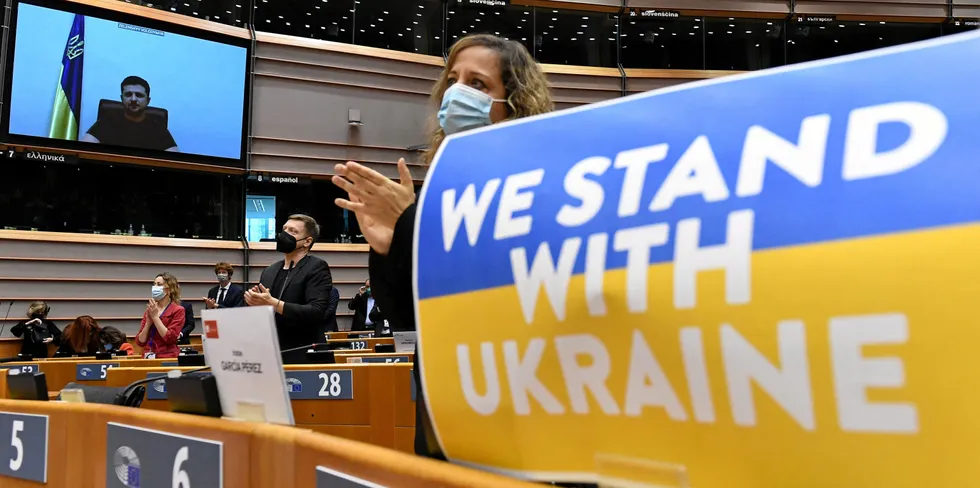 Members of the European Parliament applaud Ukranian president Volodymyr Zelensky as he speaks during a special plenary session on 1 March.