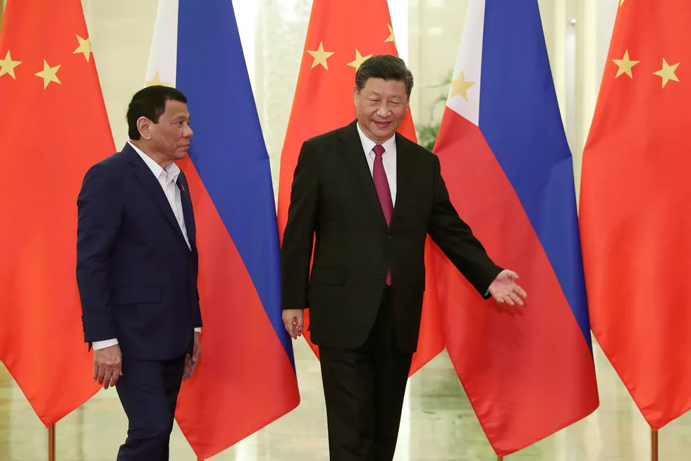 Talks: Philippines President Rodrigo Duterte, left, and Chinese President Xi Jinping, have been in talks to resolve a maritime boundary dispute