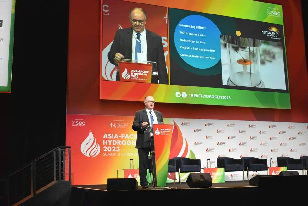 Star Scientific global group chairman Andrew Horvath speaking at the Asia-Pacific Hydrogen Summit in Sydney on Friday. The picture on the right side of the screen shows the disc-shaped catalyst at high temperature.